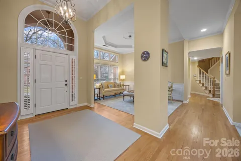 a view of a livingroom with furniture and an entryway