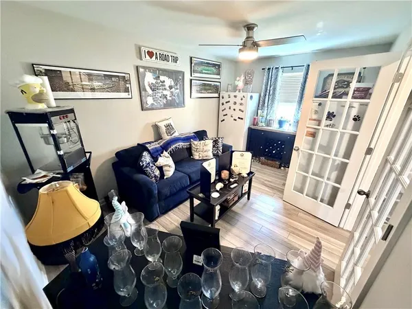 a living room with furniture rug and a window