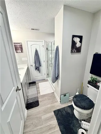 a view of walk in closet with clothes