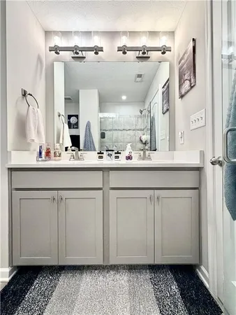 a bathroom with a shower and a tub