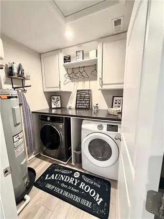 a living room with furniture gym equipment and a view of kitchen