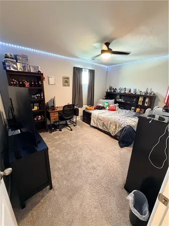 a bathroom with a sink toilet a mirror and vanity