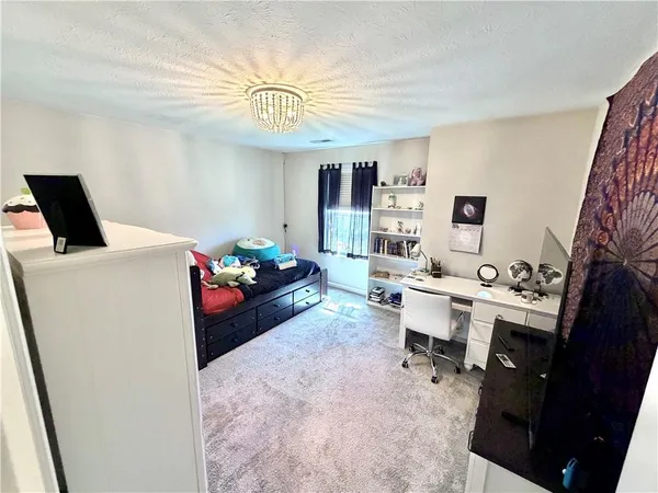 a house view with a sitting space and garden space