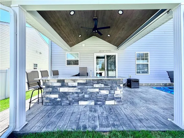 a view of a two chairs in the balcony
