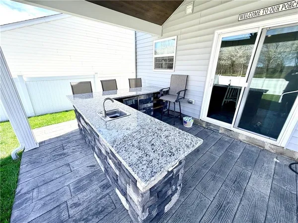 a view of backyard with furniture and garden