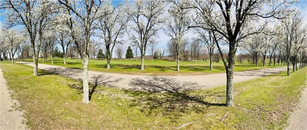 a view of a swimming pool and a yard