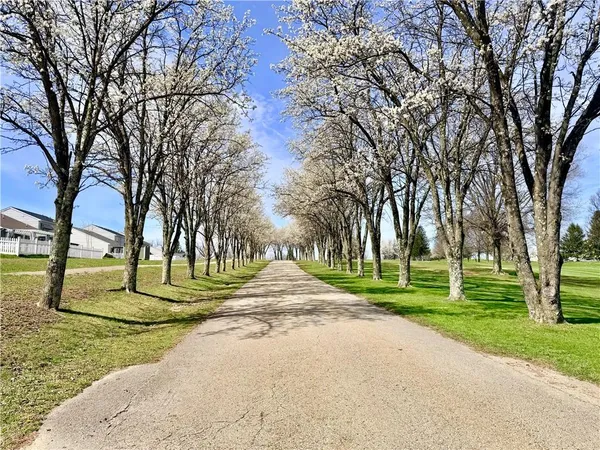 a view of multiple houses with a street