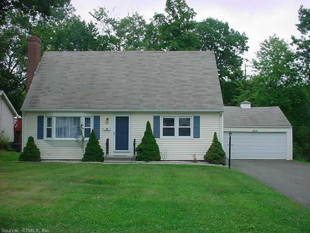 a view of a house with a yard and plants