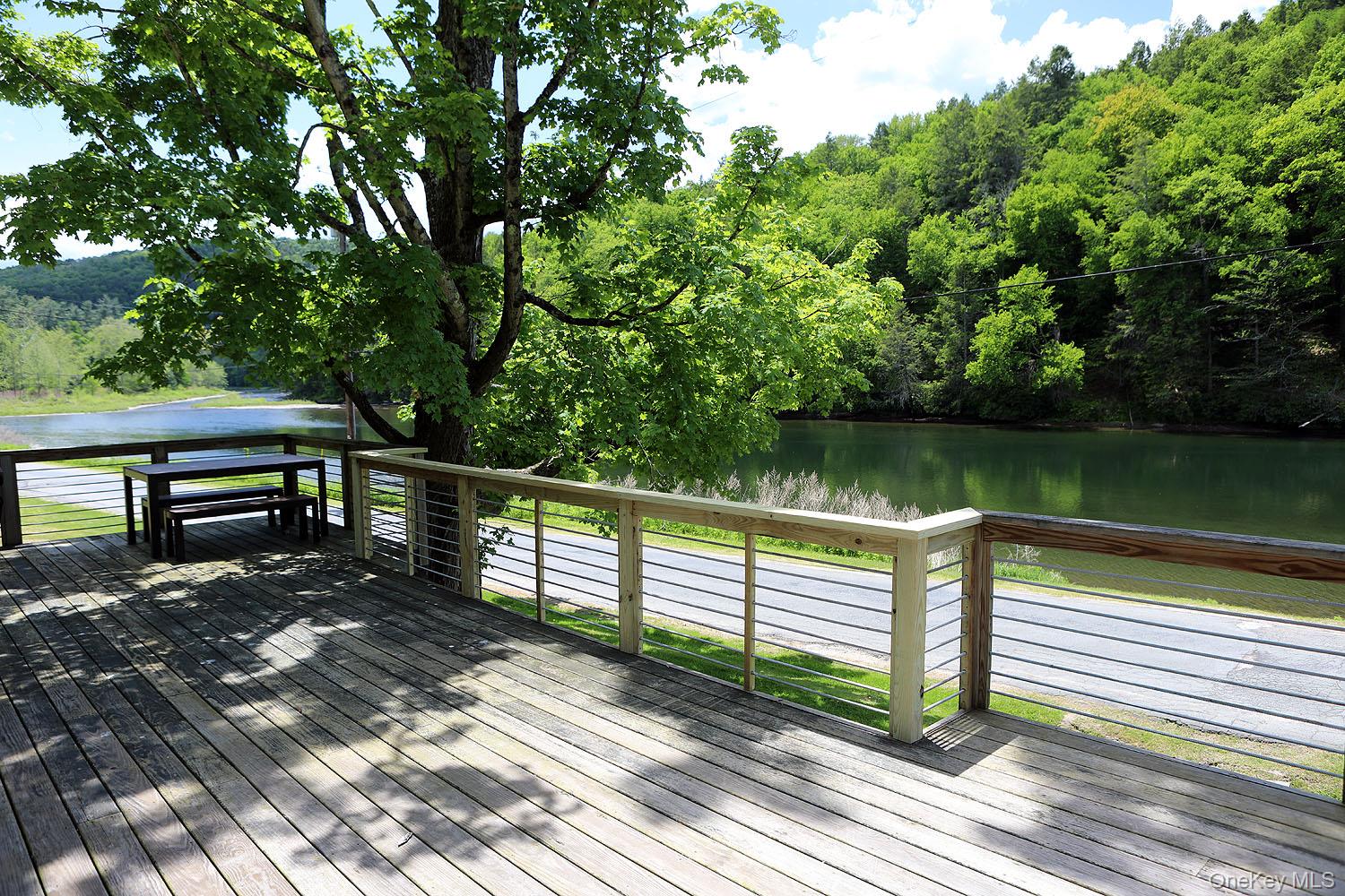 5120 Peas Eddy Road Hancock, NY 13783 - Photo 5 of 37 a view of a wooden deck with a bench