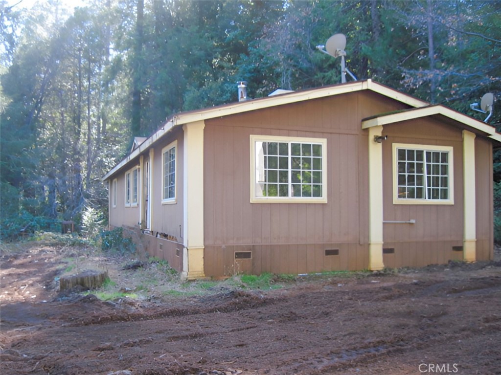 39 Weiss Hill Road Oroville, CA 95966 - Photo 1 of 1 a house with trees in the background