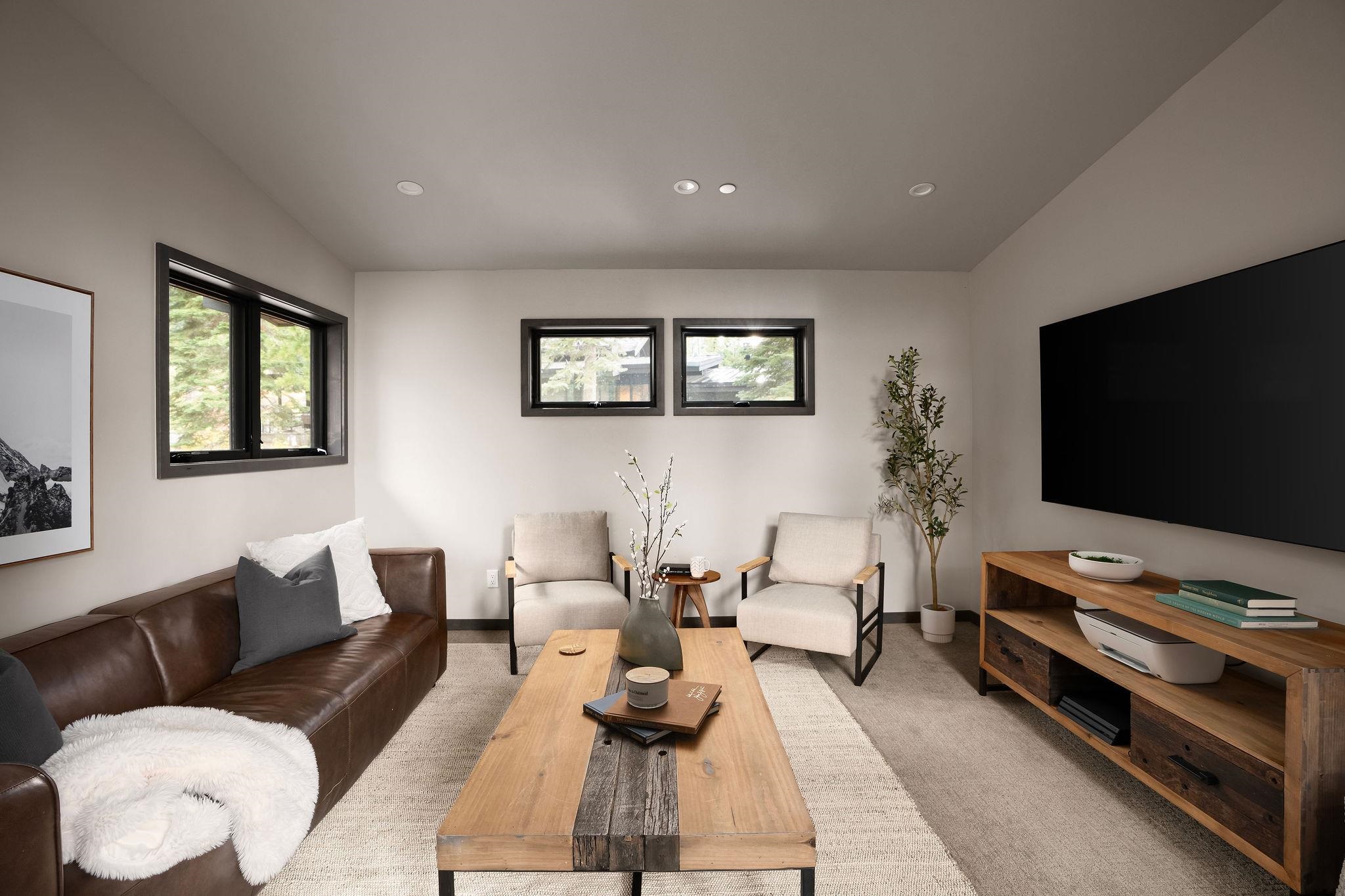 10621 Carson Range Road Truckee, CA 96161 - Photo 14 of 28 a living room with furniture and a flat screen tv