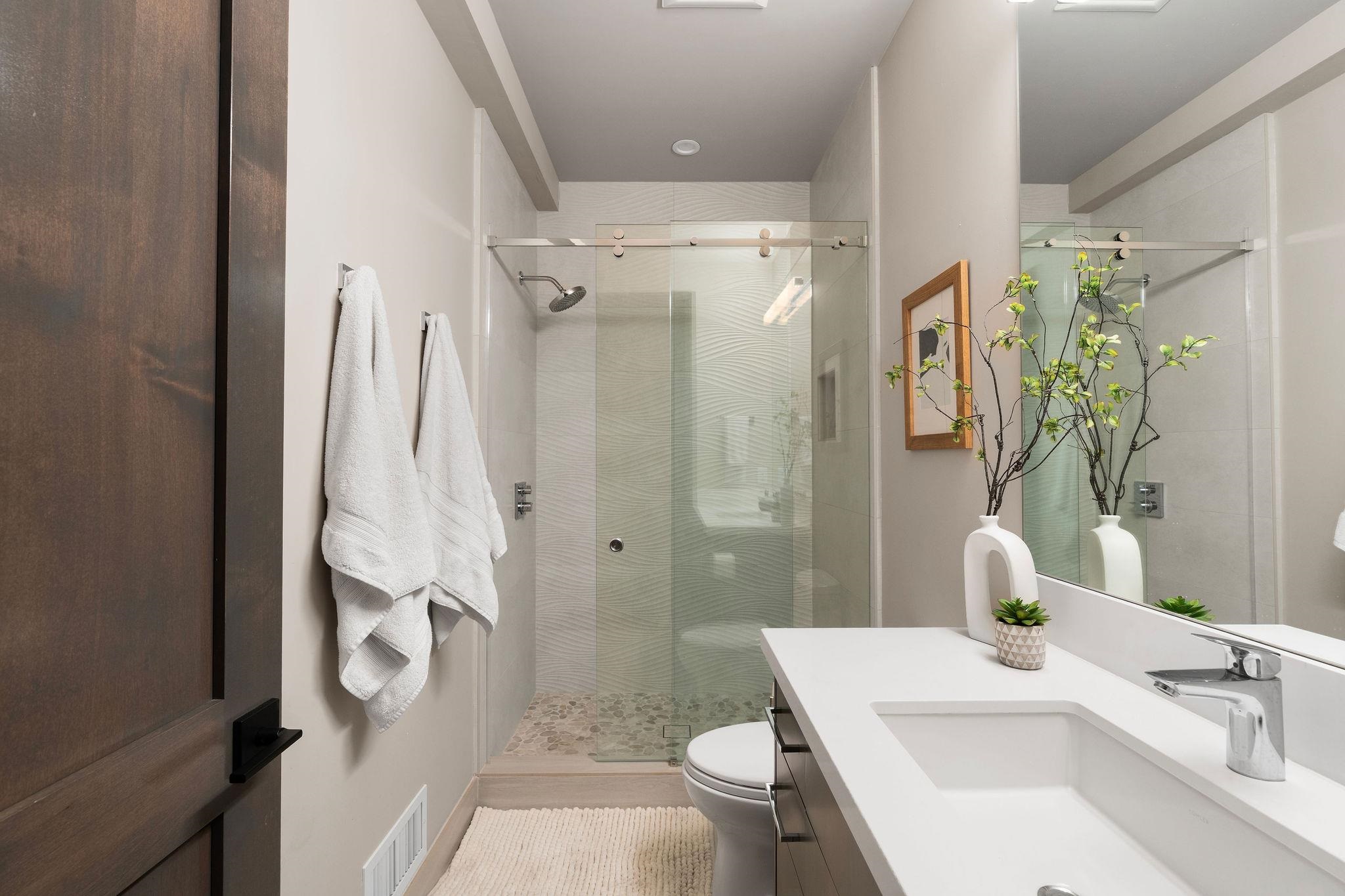 10621 Carson Range Road Truckee, CA 96161 - Photo 19 of 28 a bathroom with a sink toilet and shower