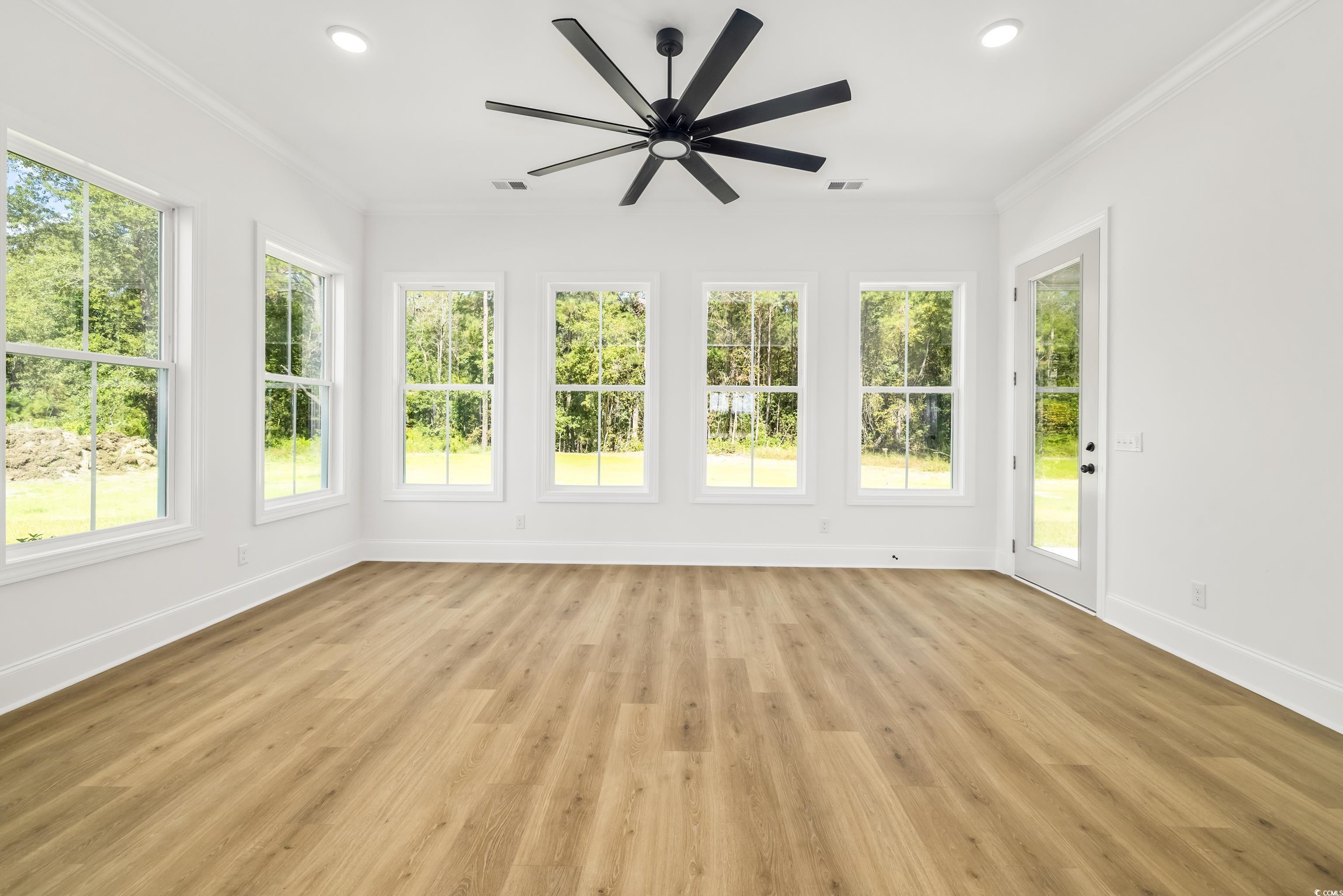 346 Ridge Road Galivants Ferry, SC 29544 - Photo 18 of 28 Unfurnished sunroom with crown molding, wood finished floors, and recessed lighting