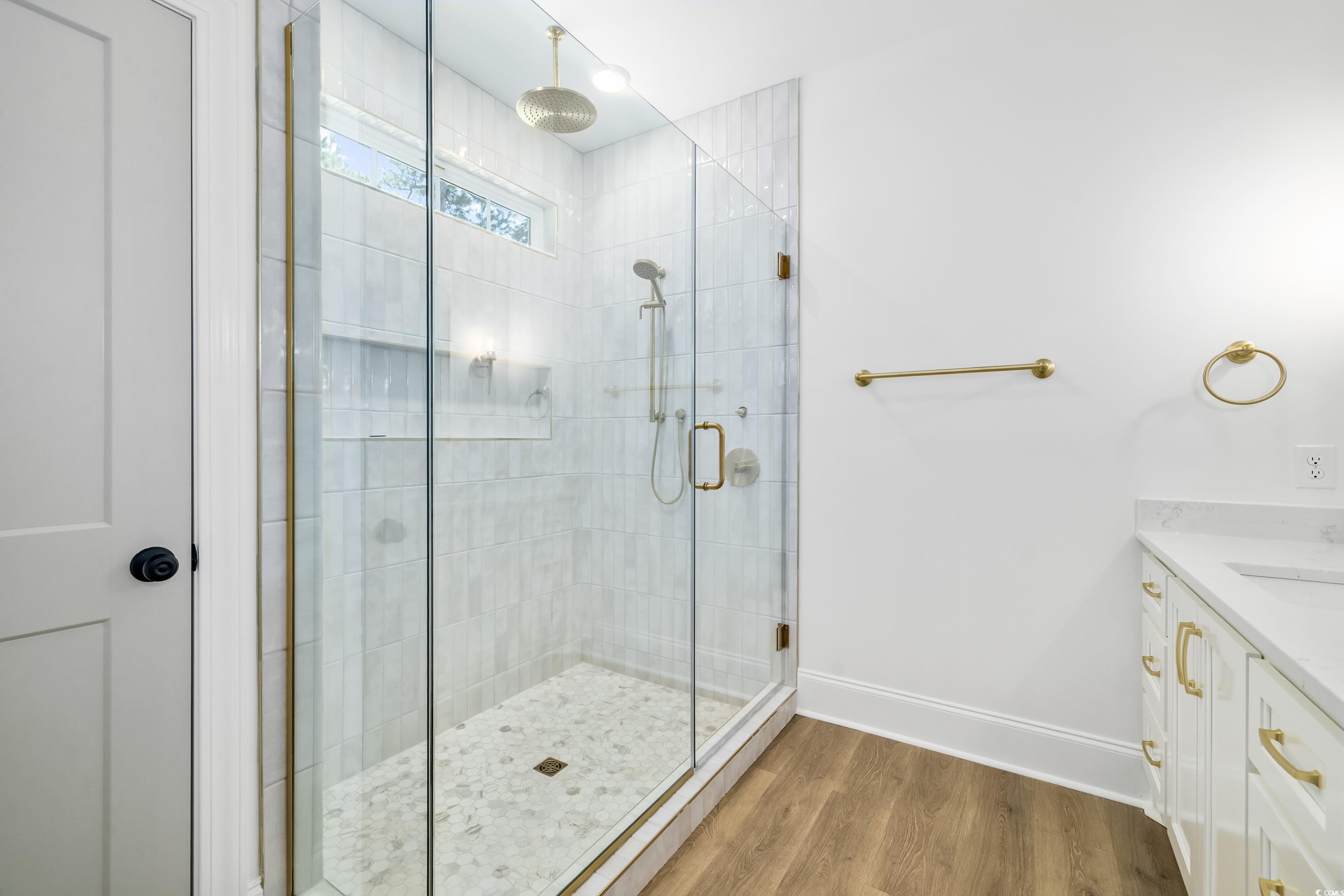 346 Ridge Road Galivants Ferry, SC 29544 - Photo 21 of 28 Full bathroom with a shower stall, vanity, and wood finished floors