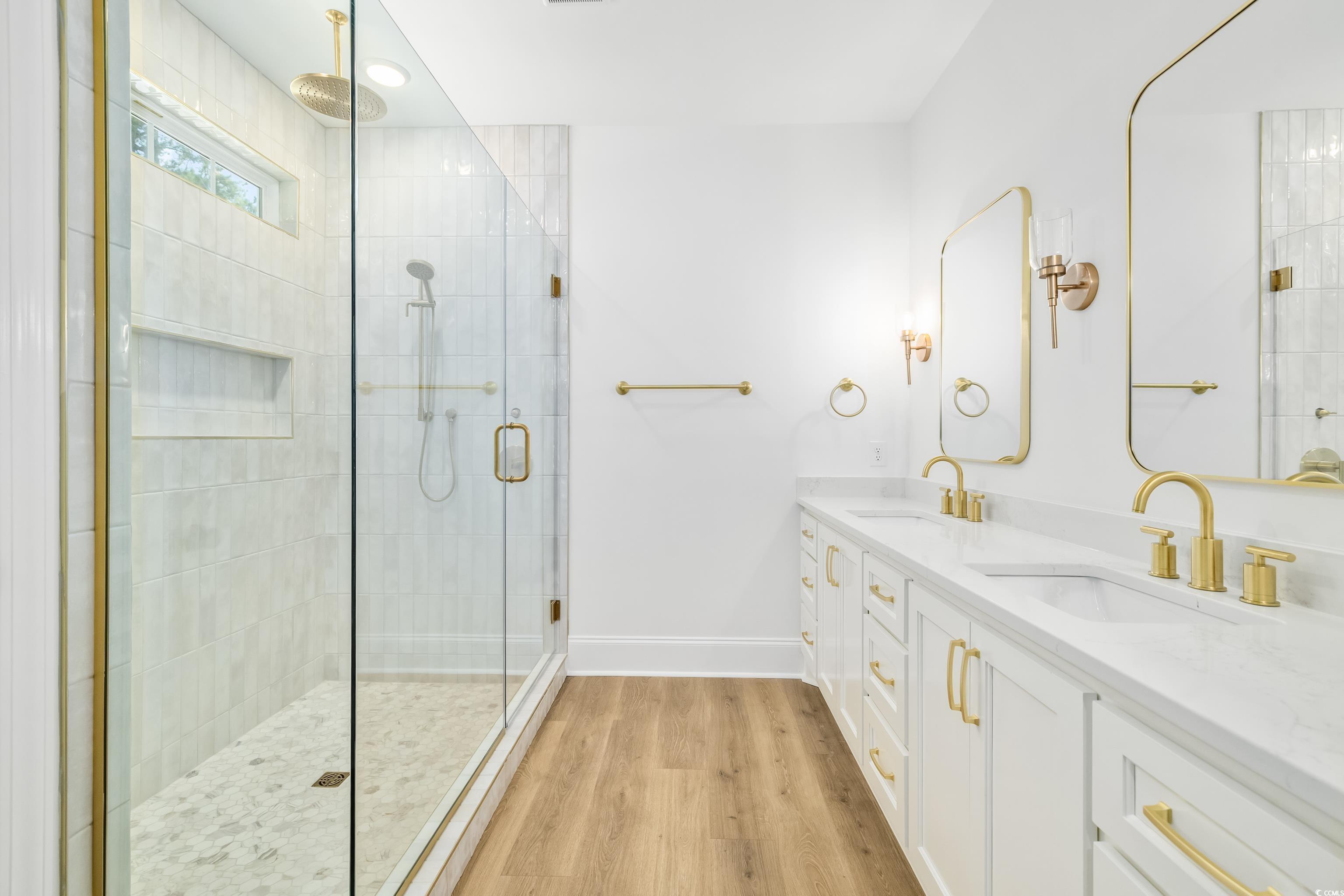 346 Ridge Road Galivants Ferry, SC 29544 - Photo 6 of 28 Full bathroom with a stall shower, light wood-style flooring, and double vanity