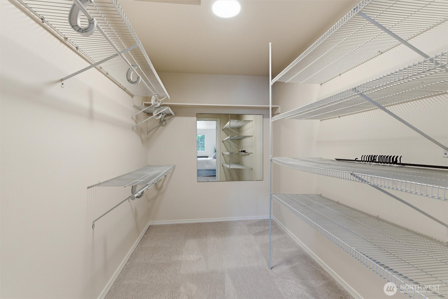 2101 233rd Street Southeast Bothell, WA 98021 - Photo 18 of 40 a view of walk in closet with empty racks