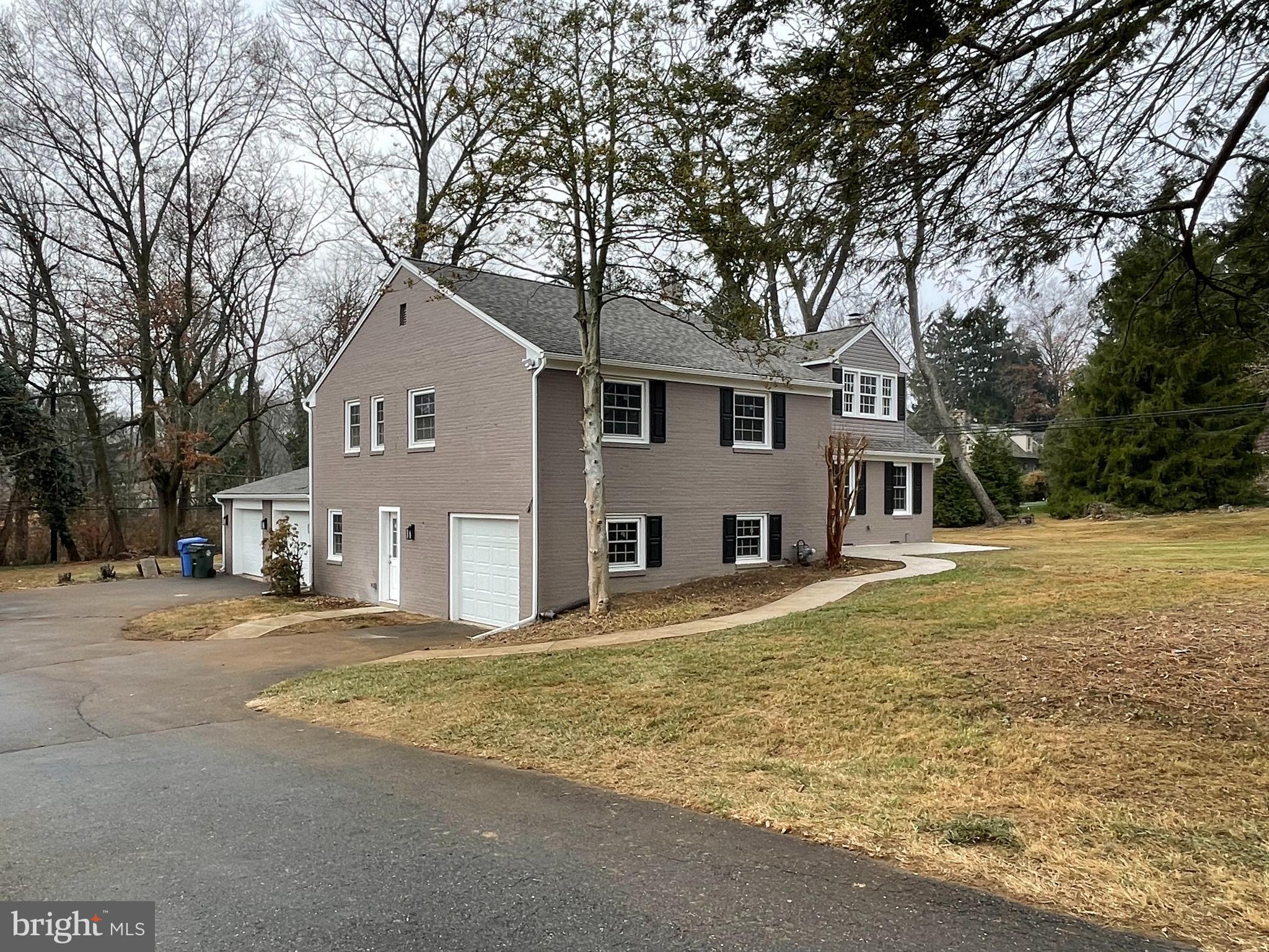 212 Grandview Road Media, PA 19063 - Photo 3 of 49 a front view of a house with a garden