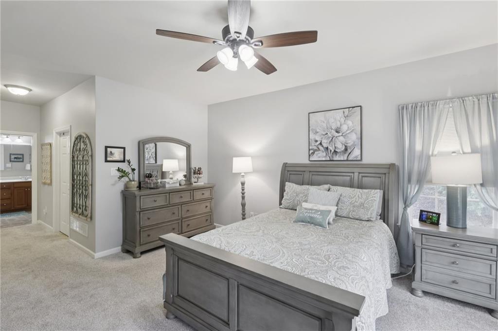 122 Liberty Lane Freedom, PA 15042 - Photo 16 of 50 a bedroom with a bed and a chandelier