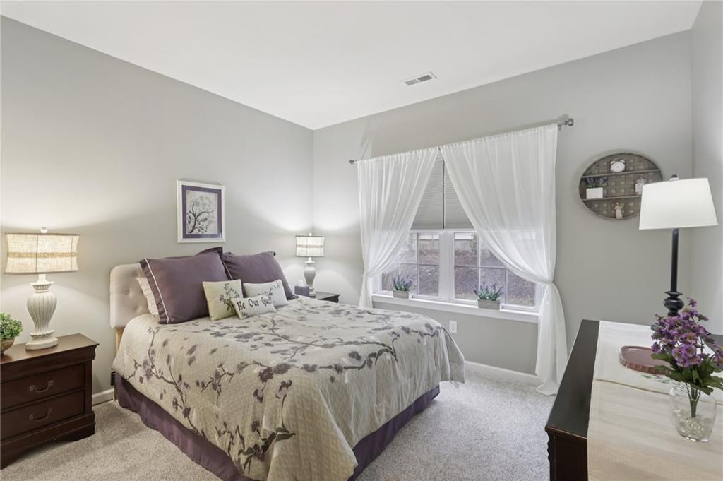 122 Liberty Lane Freedom, PA 15042 - Photo 22 of 50 a bedroom with a bed and a lamp