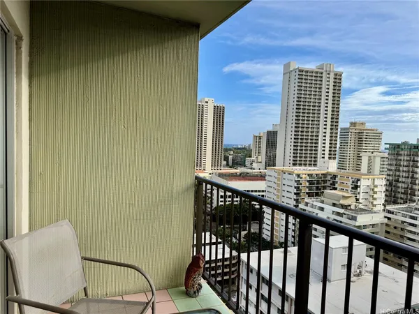 a view of a balcony with chairs