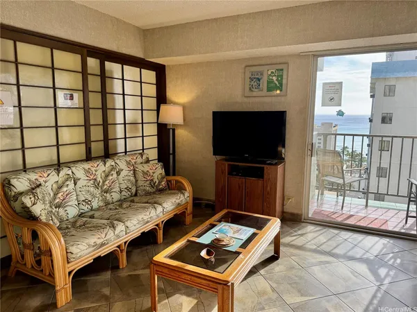 a living room with a couch and a flat screen tv