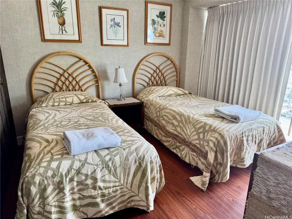 a bedroom with bed and a table