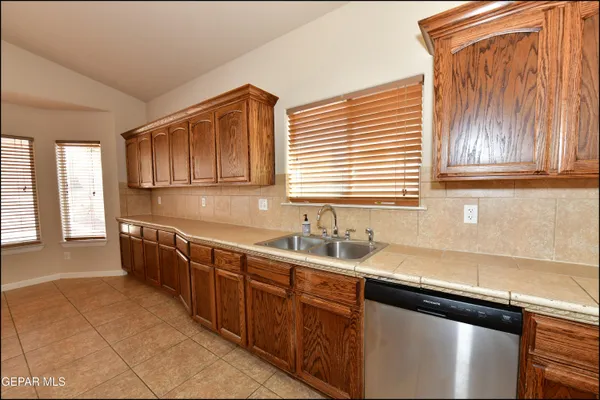 a kitchen with a sink and cabinets