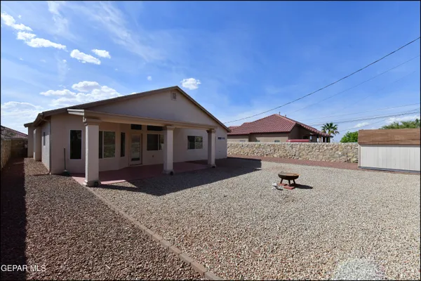 a house view with a backyard space