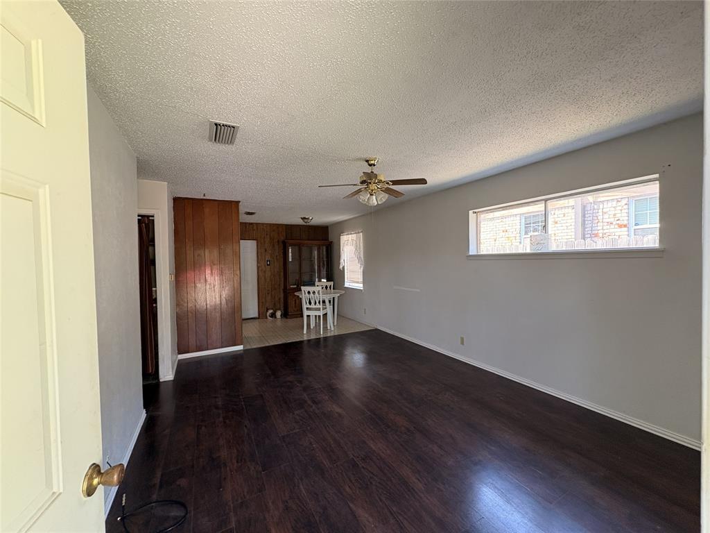 1829 South Center Street Denison, TX 75021 - Photo 7 of 29 a view of empty room with wooden floor