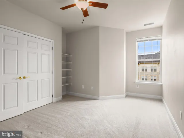 a bathroom with a shower sink and mirror