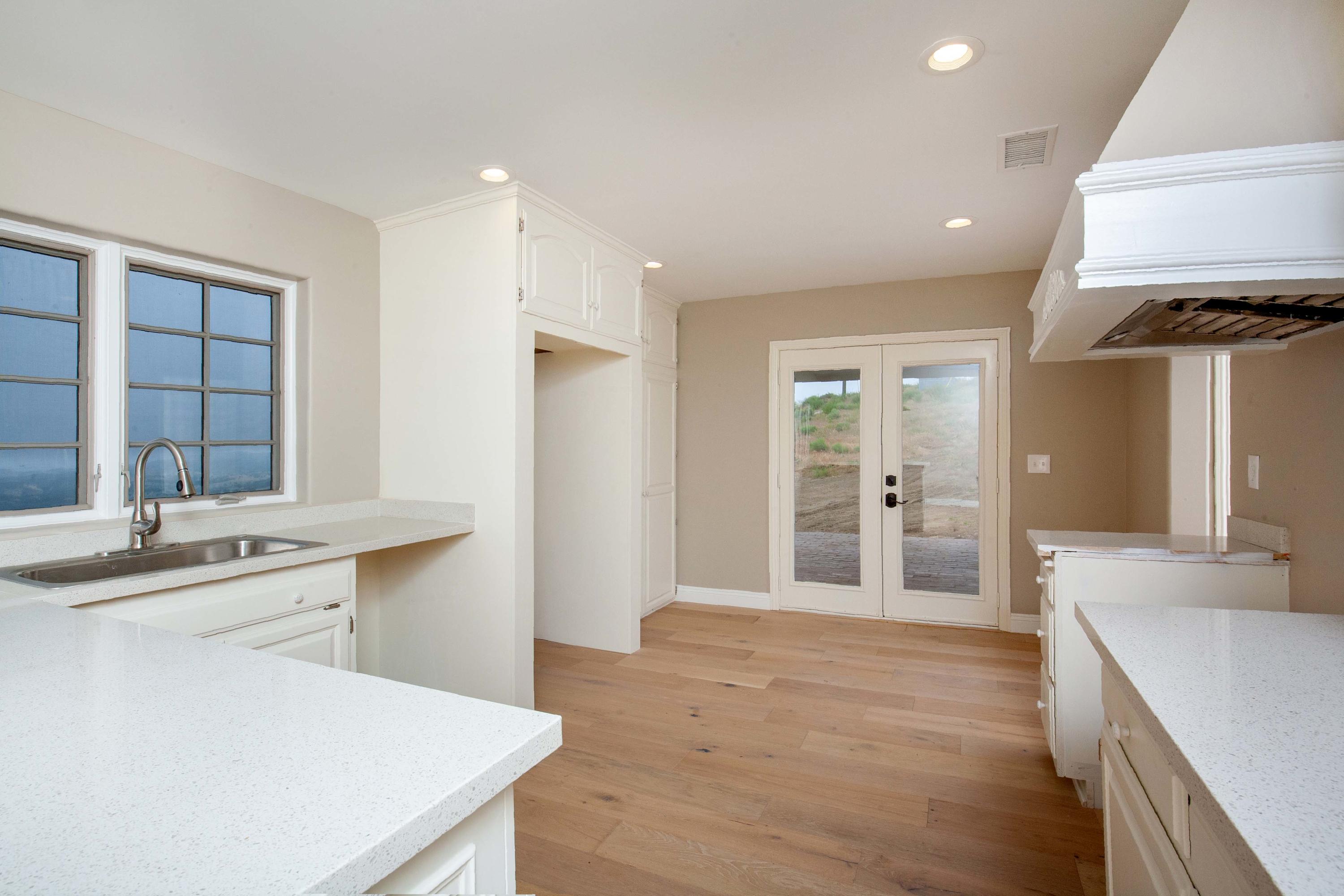 47383 Old Ridge Route Lake Hughes, CA 93532 - Photo 8 of 23 a kitchen with stainless steel appliances a sink stove and refrigerator