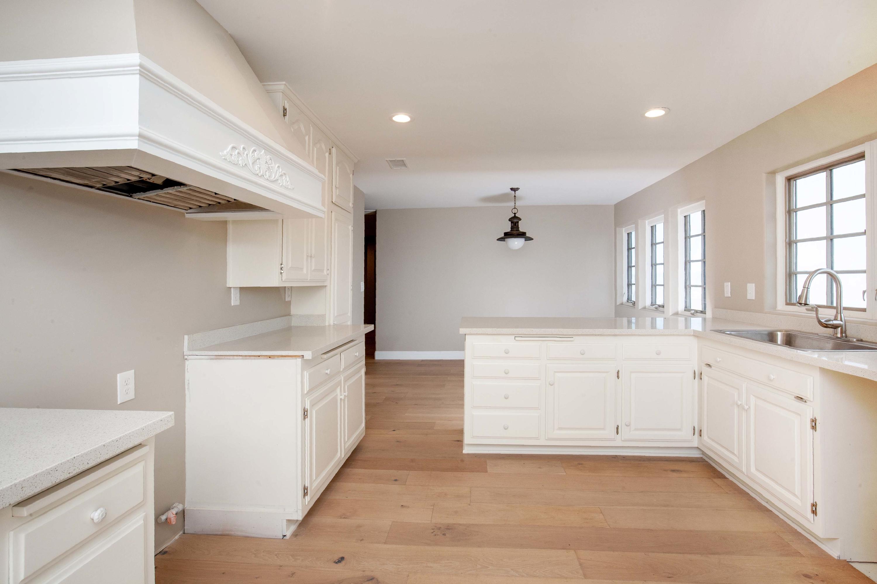 47383 Old Ridge Route Lake Hughes, CA 93532 - Photo 9 of 23 a large kitchen with a lot of counter space and wooden floor