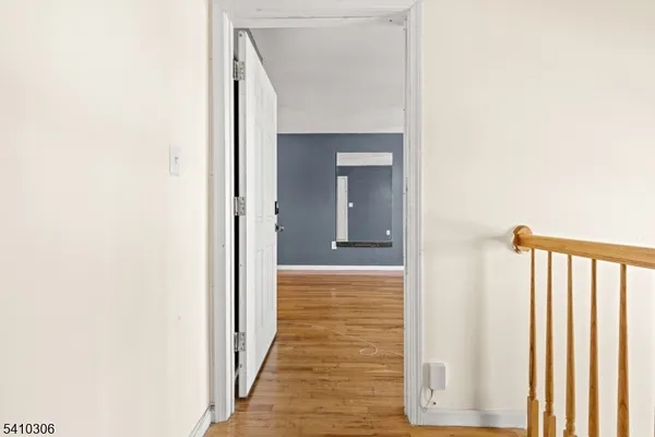 a view of a bathroom from a hallway