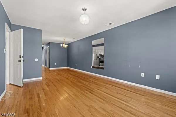 a bathroom with a sink shower and a mirror