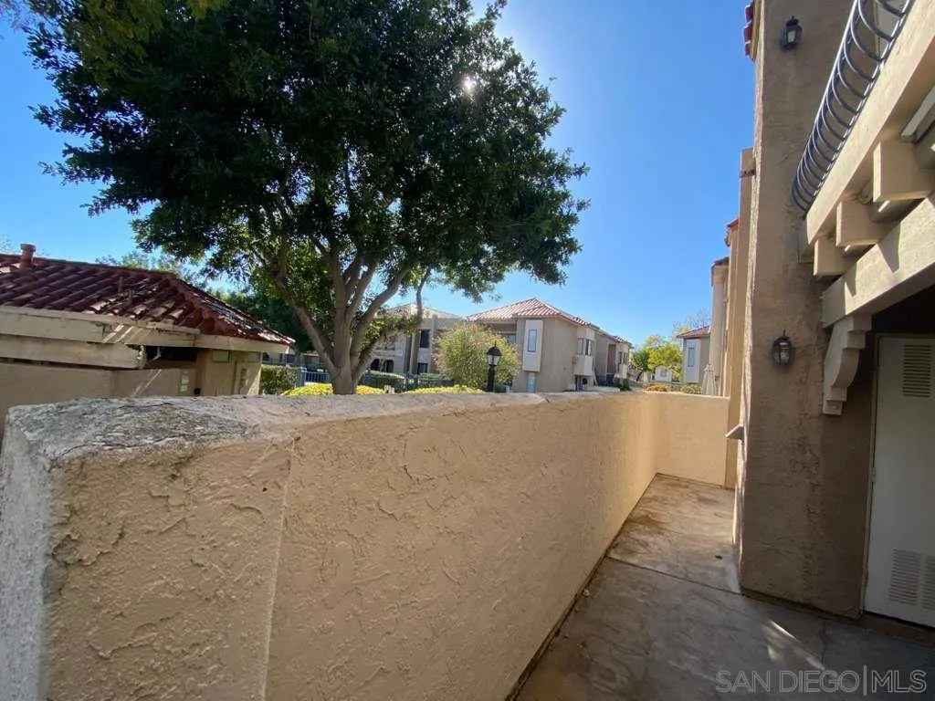11174 Kelowna Road San Diego, CA 92126 - Photo 4 of 16 a front view of a house with a yard