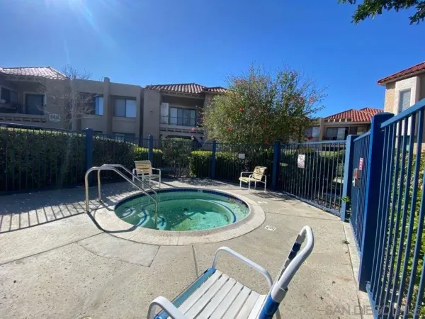 a swimming pool with outdoor seating and yard