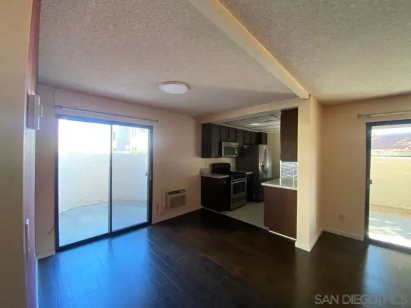 a view of a living room with hardwood floor