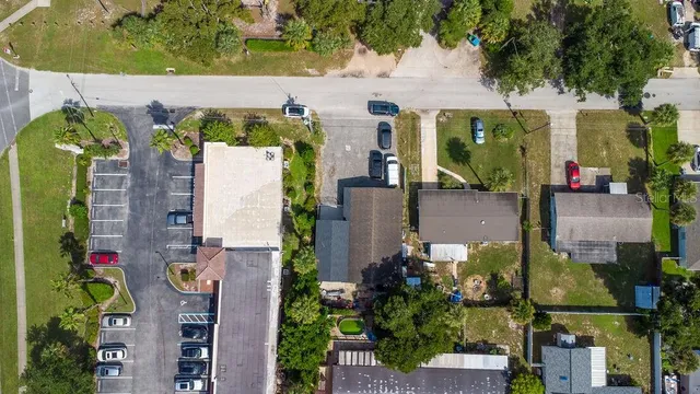 an aerial view of houses with an outdoor space