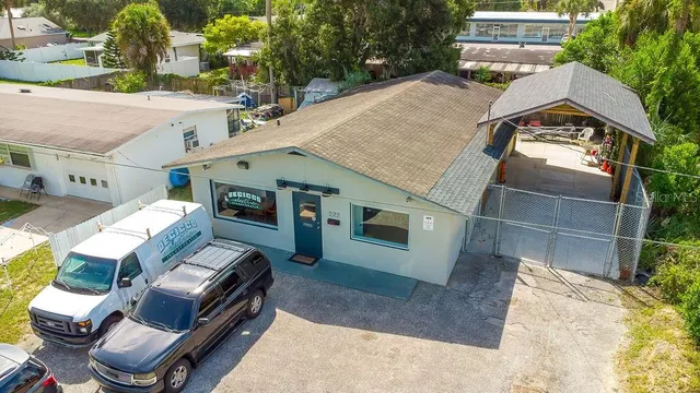 an aerial view of a house with outdoor space