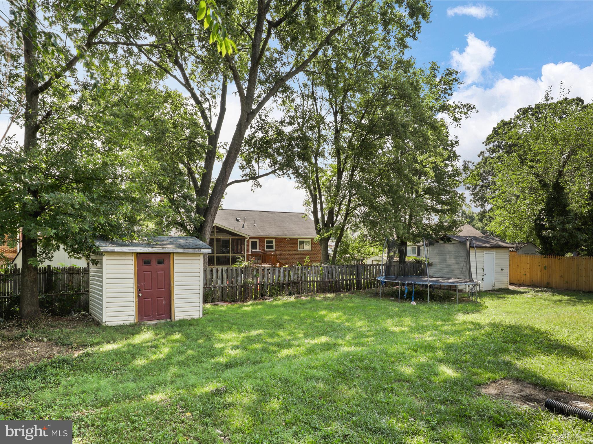 6019 Frederick Street Springfield, VA 22150 - Photo 54 of 65 a view of a house with a yard and large tree