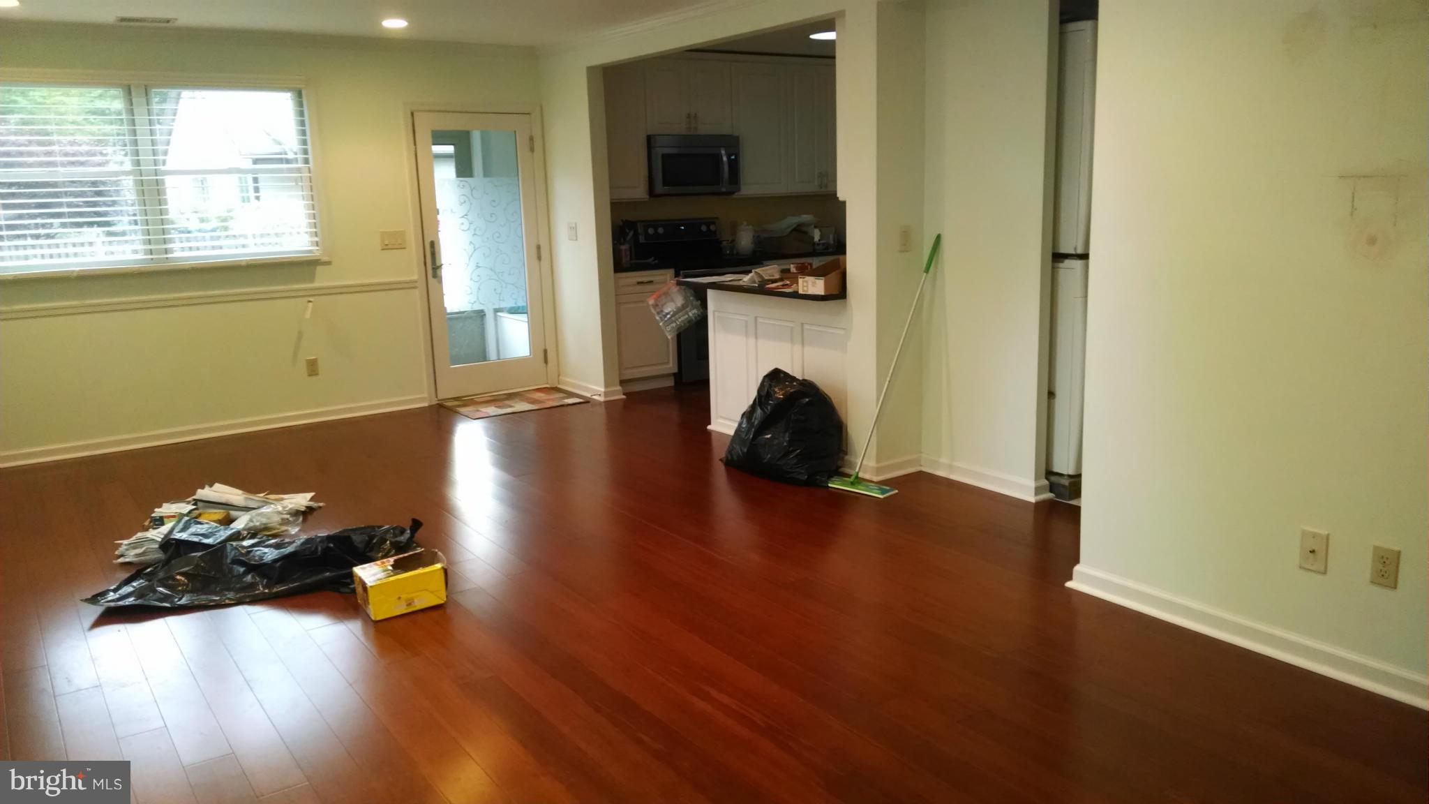 15 McKay Circle Cabin John, MD 20818 - Photo 6 of 20 a room with a couch and a wooden floor