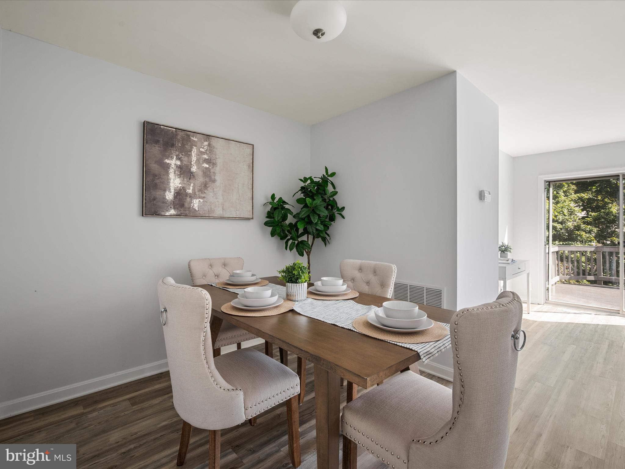20198 Brookview Square Ashburn, VA 20147 - Photo 15 of 61 a view of a dining room with furniture window and wooden floor