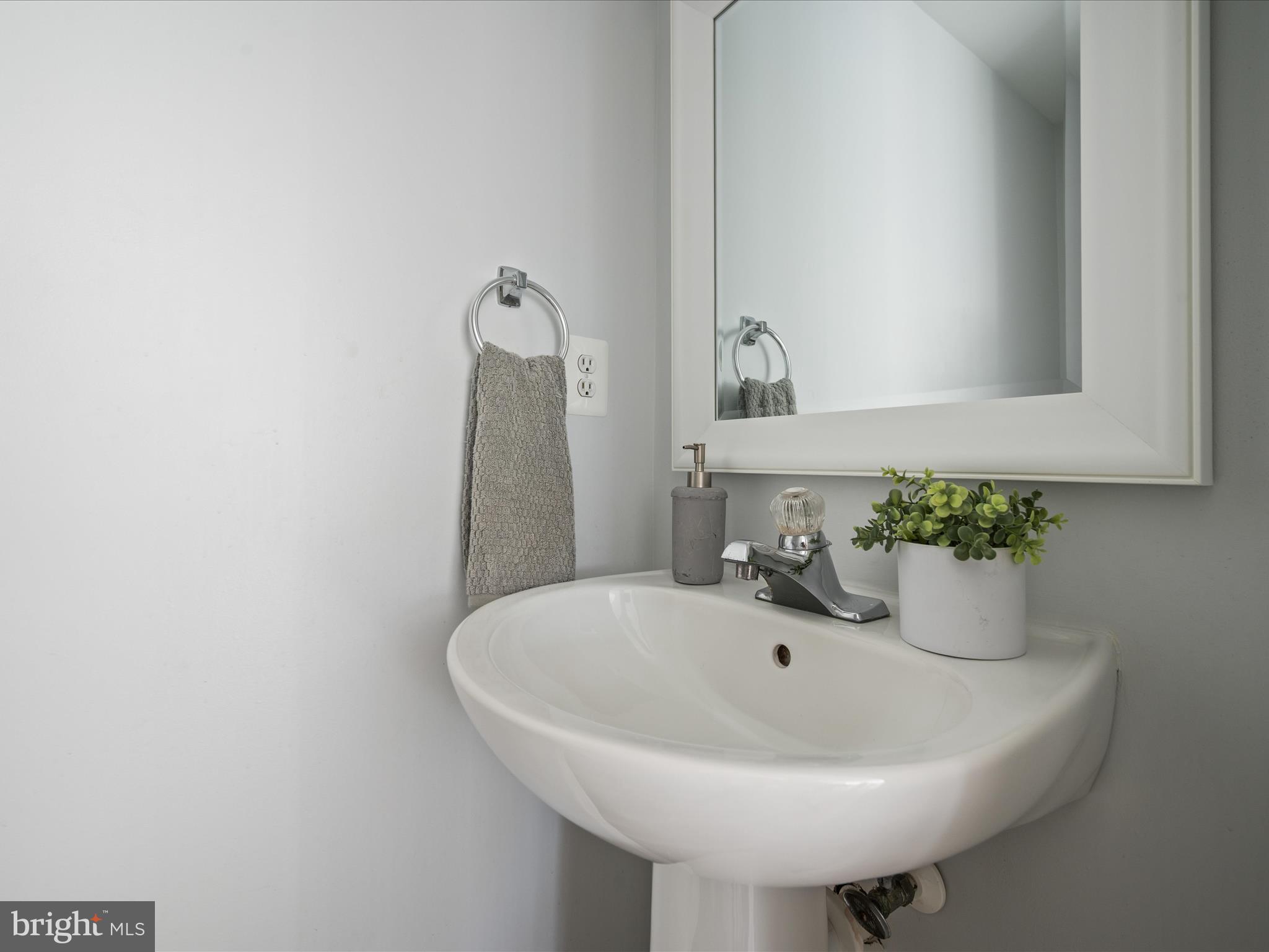 20198 Brookview Square Ashburn, VA 20147 - Photo 17 of 61 a bathroom with a sink and a mirror