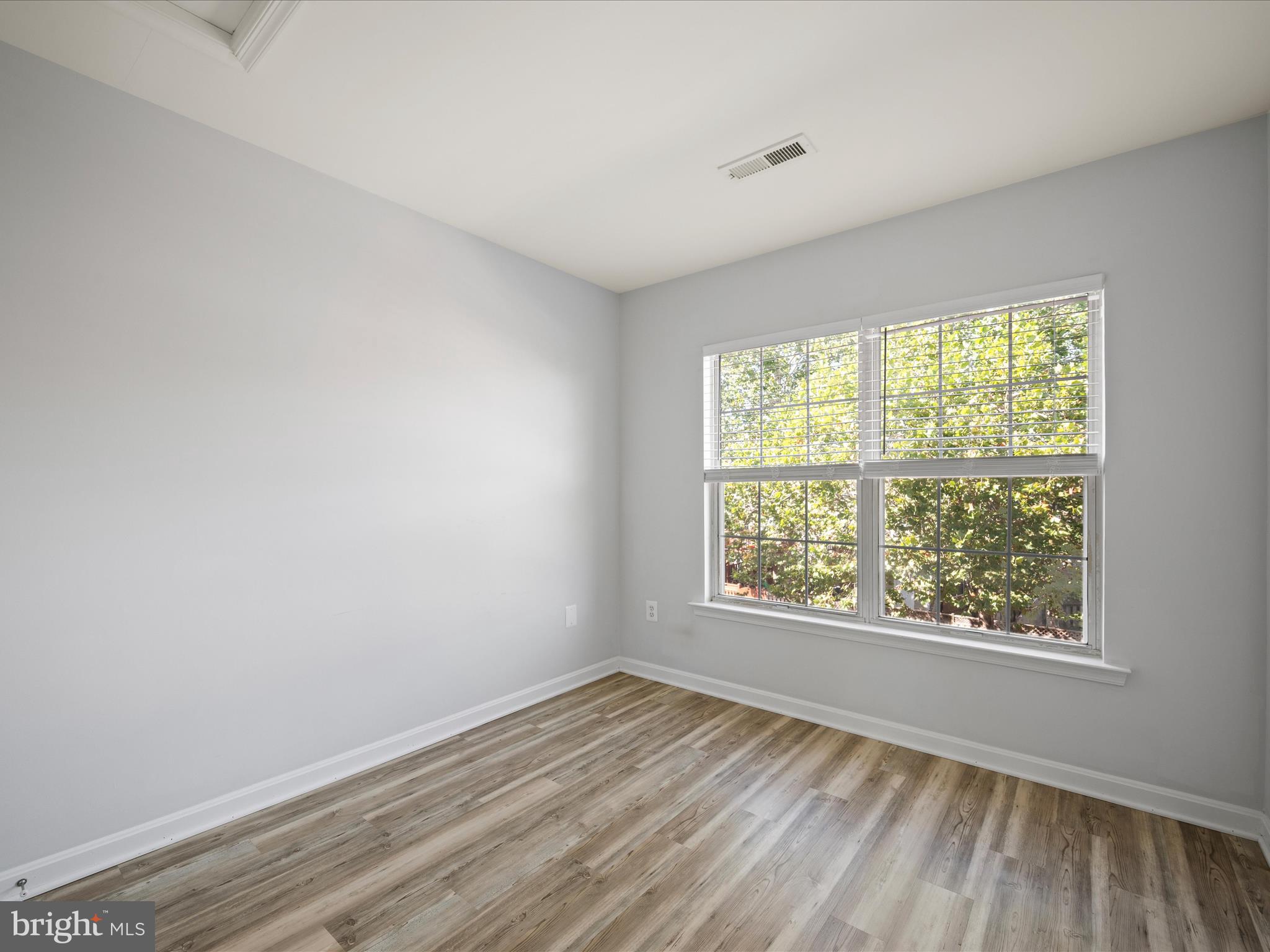 20198 Brookview Square Ashburn, VA 20147 - Photo 29 of 61 wooden floor in an empty room with a window