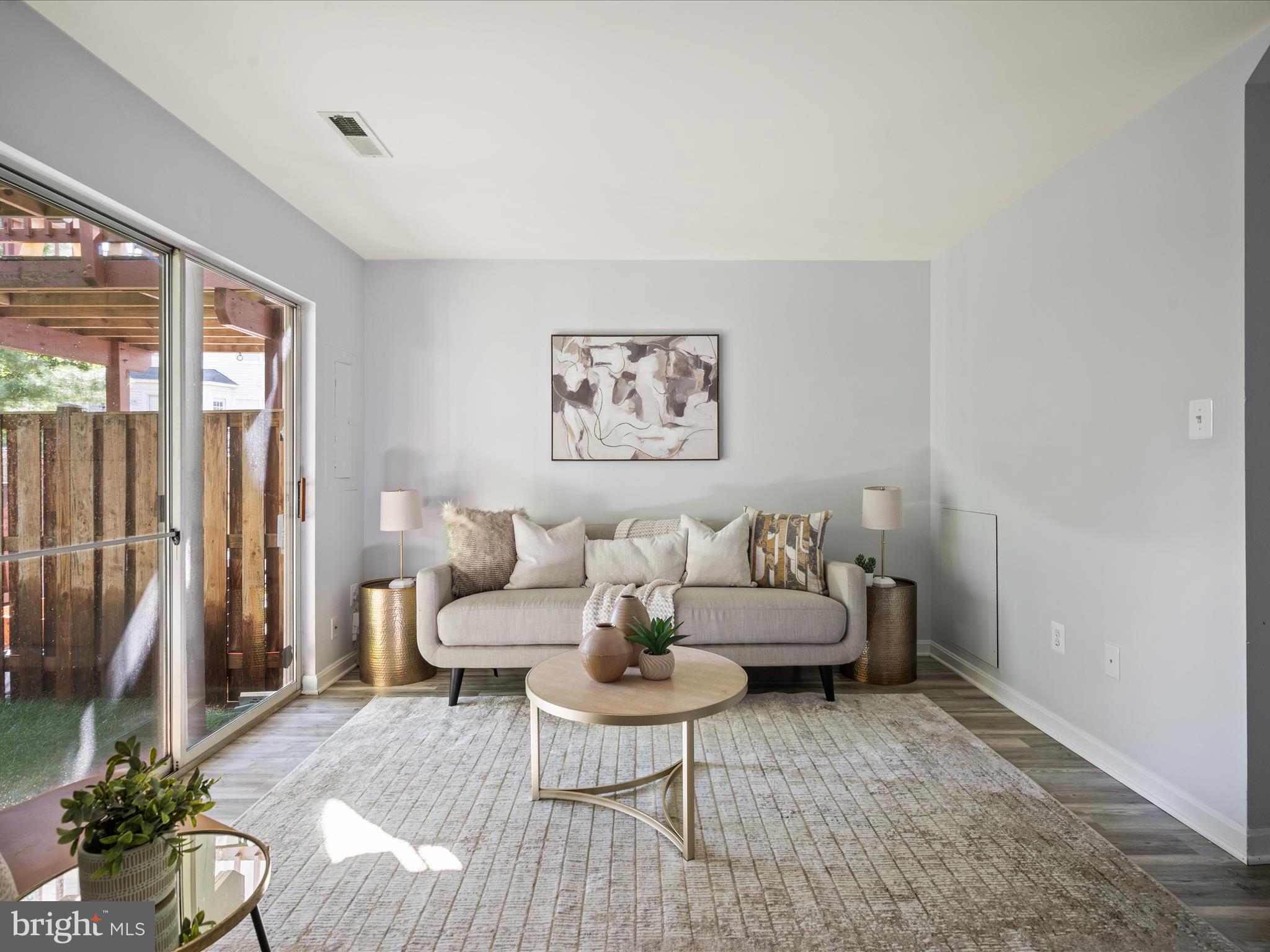 20198 Brookview Square Ashburn, VA 20147 - Photo 7 of 61 a living room with furniture and a large window