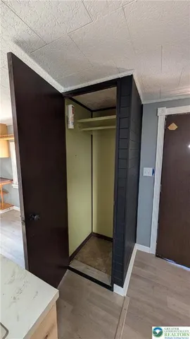 a view of a house with swimming pool and sitting area