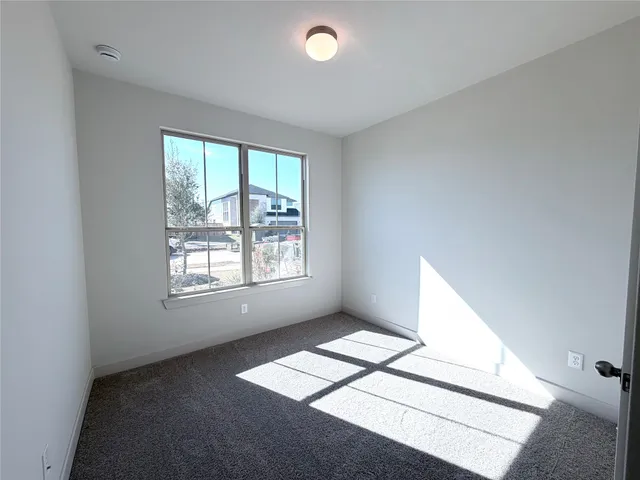 a view of wooden floor and windows in a room