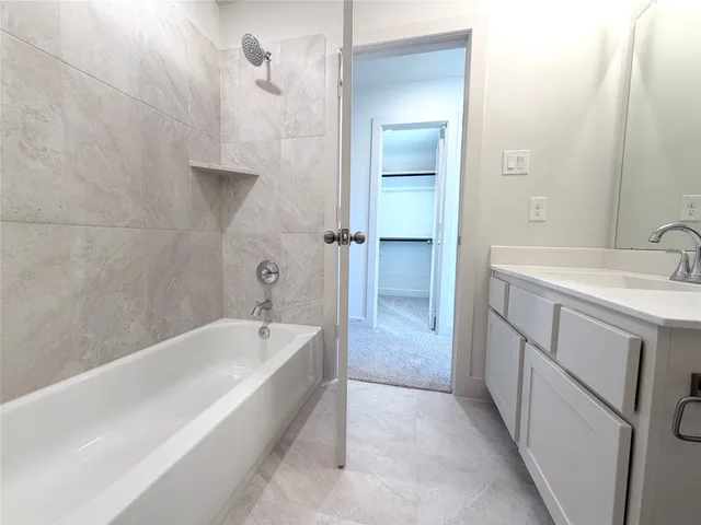 a bathroom with a sink toilet and mirror