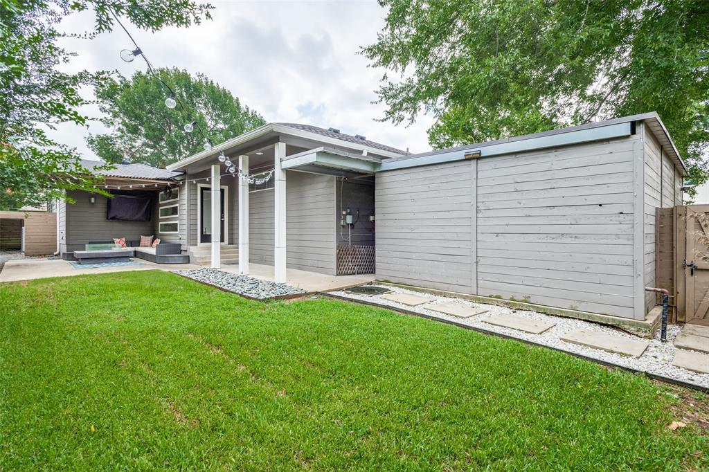 9803 Lakemont Drive Dallas, TX 75220 - Photo 12 of 13 a front view of house with yard and green space