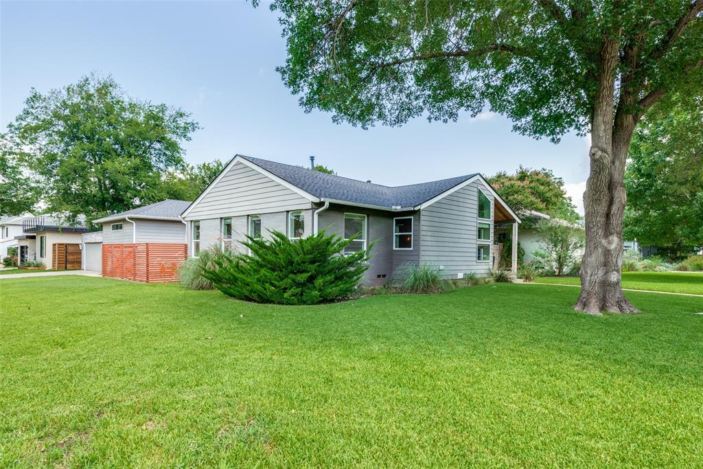 9803 Lakemont Drive Dallas, TX 75220 - Photo 13 of 13 a view of a house with a big yard potted plants and large tree
